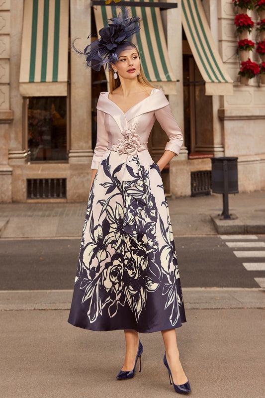 Veni Infantino 992520 Rose / Navy Print A Line Mother Of The Bride Dress
This beautiful mid length dress features three quarter length sleeves and a flattering v-neck neckline with fitted bodice.