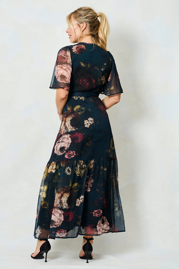 Hope & Ivy Abby Black & Green Patterned Wrap Dress
The Abby Flutter Sleeve Maxi Wrap Dress with Tie Waist
Have heads turning all season long in this classic Hope & Ivy wrap dress