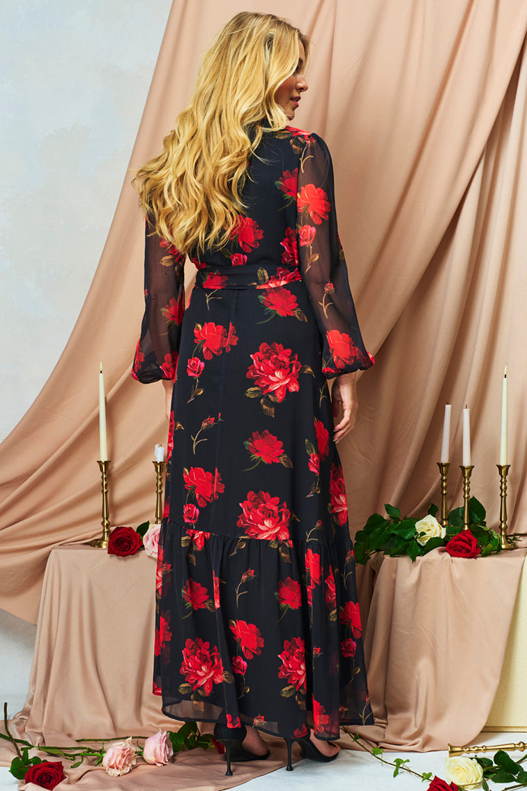 The Camilla Blouson Sleeve Maxi Wrap Dress with Tie Waist
Have heads turning all season long in this classic Hope & Ivy wrap dress – new in for AW25. The Camilla is set to be a seasonal favourite, with bright red, hand-stylised blooms decorating a stylish, chiffon base.