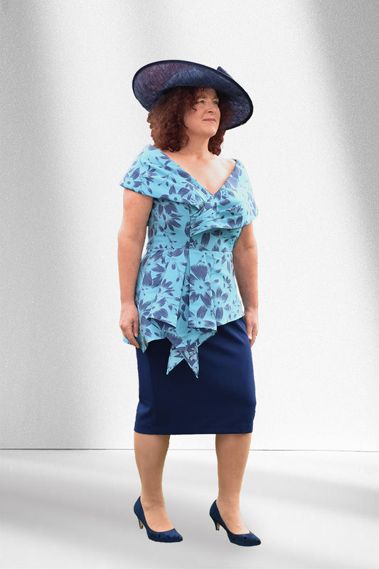 Dressed Up 424 Navy/Turquoise Dress

A navy turquoise dress with a floral pattern to the top.
Cross over neckline with a peplum waist detail and fitted skirt.
