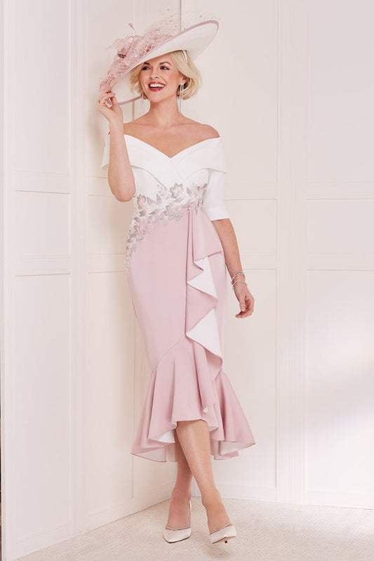 The beautiful bardot neckline is combined with a fluted skirt, creating a feminine and elegant silhouette.